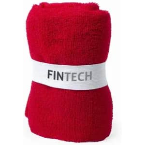 A red towel rolled and secured with a white band featuring a logo.