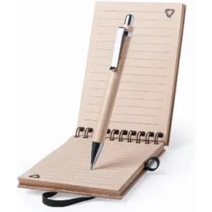 A notepad with a wooden cover and a pen on top, featuring lined pages and a spiral binding.