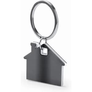 A keyring shaped like a house in metallic silver with a glossy finish. It features a circular attachment.