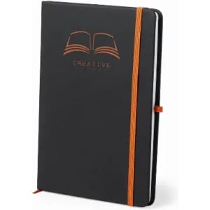 A black notebook featuring an orange elastic band and embossed logo on the cover.