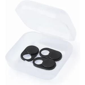 A set of three black camera lens covers inside a clear plastic case.