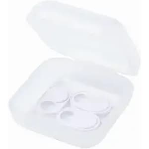 A clear, square container with a lid holding three small white items inside.