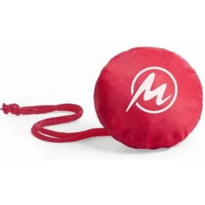 A red round promotional product with a white logo and a attached string.