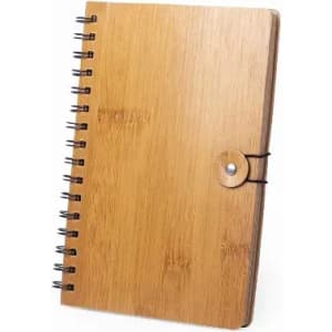 A notebook with a bamboo cover, featuring spiral binding and a button closure. It has a natural wood texture.