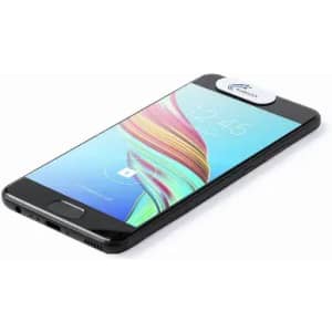 A smartphone in black with a circular white branding badge on the top edge of the screen.