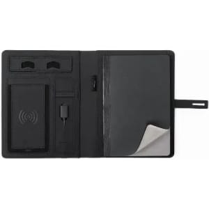 A black promotional product featuring a notebook with a wireless charger and storage pockets, plus a strap closure.