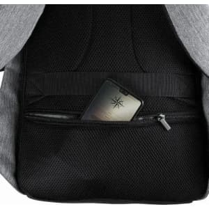 A grey backpack interior features a mesh pocket holding a smartphone, with additional storage compartments visible.