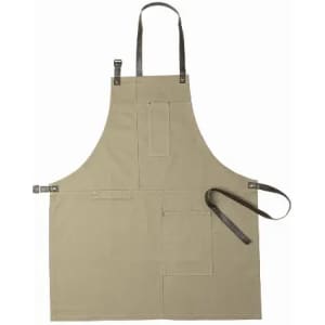 A beige apron featuring multiple pockets and leather straps for adjustment. It has a simple and functional design.