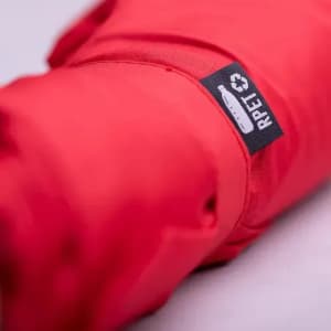 A red drink bottle wrapped in a protective sleeve with a logo and branding.