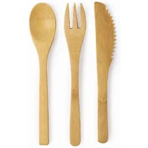 A set of bamboo utensils including a spoon, fork, and knife, all in a natural light brown colour.