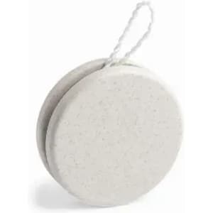A round, beige soap bar with a textured surface, featuring a attached string for hanging.