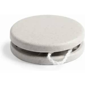 A circular grey yo-yo with a textured surface and a white string attached. It features a simple design.