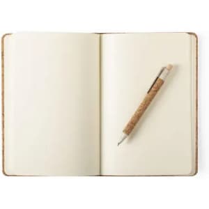 A blank notebook with a cork pen resting on the right page. The cover is a textured brown.