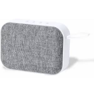 A portable speaker in grey fabric with a white body and a convenient carrying strap. It features control buttons on top.