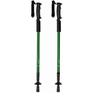 Two green trekking poles with black grips and straps, featuring rubber tips for traction.