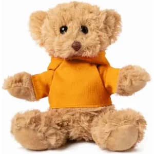 A teddy bear with brown fur wearing an orange hoodie, sitting upright. It has small black eyes and a cute expression.