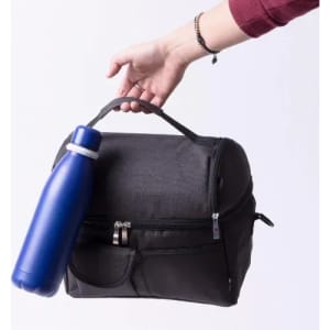A drink bottle in blue is being held next to a black bag, featuring a handle and zippered compartment.