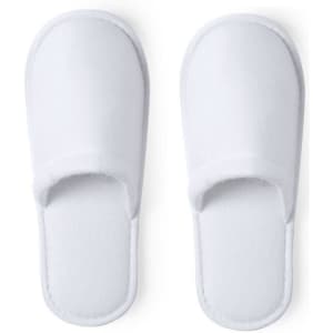A pair of white, soft slippers with open toes and a simple design, featuring a smooth texture.