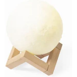 A decorative sphere in a pale yellow hue, resting on a wooden stand. The design is modern and minimalistic.