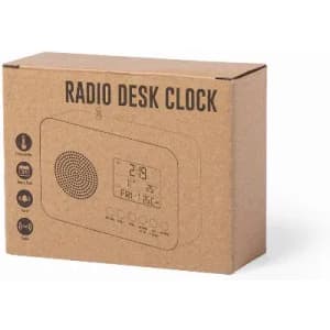 A cardboard box containing a radio desk clock. The box features a graphic of the clock and has a simple design.