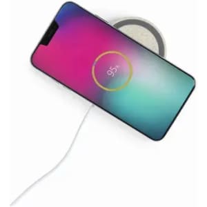 A smartphone displayed on a wireless charger, featuring a vibrant gradient screen and a charging indicator.