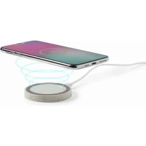 A wireless charger with a cylindrical design, featuring a textured grey base and a smartphone positioned above it.