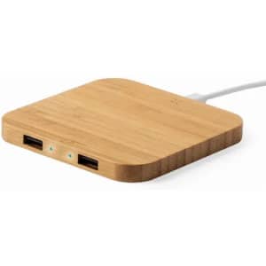 A bamboo charging pad in a square shape with two USB ports and an attached cable.