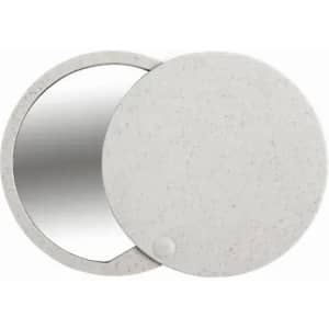 A compact mirror with a speckled grey exterior and a round shape, featuring a reflective surface inside.