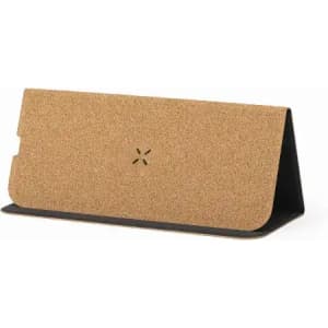 A phone stand featuring a cork surface and a black base, with a logo on the front.