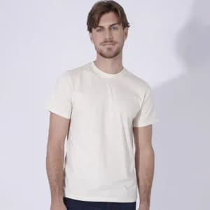 A plain cream-coloured T-shirt on a male model, featuring a simple design with a crew neckline.