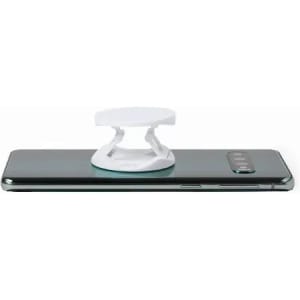 A phone stand in white, placed on the back of a sleek smartphone. The device has a simple, minimalist design.