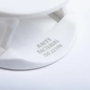 A drink bottle lid in white, featuring a branding logo and an antibacterial label.