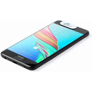 A smartphone with a vibrant display, featuring a round white logo on the top, angled on a flat surface.