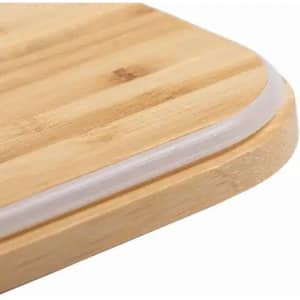 A wooden cutting board with a smooth, rounded edge and a transparent silicone strip around the border.