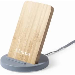 A phone stand with a bamboo back and a grey base. It includes a cable for power connection.