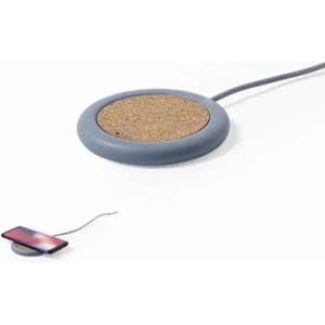 A wireless charger with a round cork surface and a grey base, featuring a cable for connection.