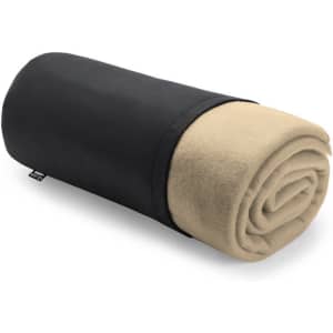 A rolled blanket with a black exterior and a beige fleece interior, neatly packaged for storage.