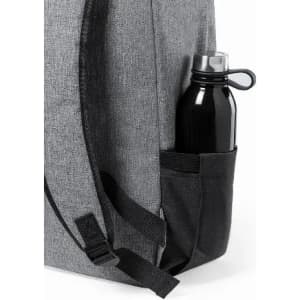 A drink bottle in a black holder, positioned on the side of a grey backpack. The backpack features adjustable straps.