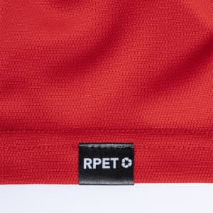 A close-up of a red fabric with a small black label featuring the text "RPET".
