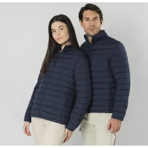 A pair of models wearing navy blue puffer jackets, standing side by side, featuring a logo on the jackets.