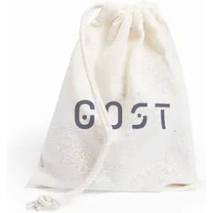 A drawstring bag in cream colour with a simple design and a logo. The bag has a textured surface.