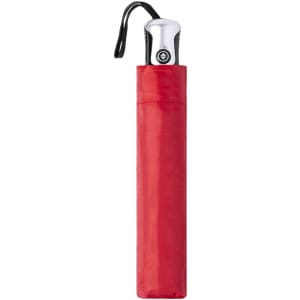 A red compact umbrella with a silver handle and a black strap, stored in a matching red sleeve.