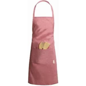 A pink apron with a front pocket holding two wooden utensils. The apron has a simple design and adjustable neck strap.