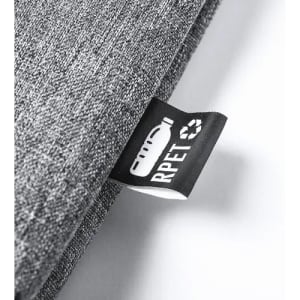 A fabric label featuring a logo on a grey material, indicating the product is made from recycled materials.