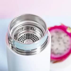 A drink bottle in white, featuring a metallic filter cap with a perforated design for infusing beverages.