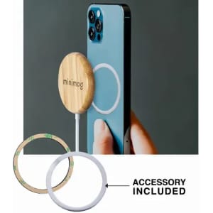 A phone with a wooden magnetic accessory attached, featuring a circular design in natural wood tones.