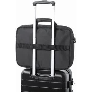 A black laptop bag securely attached to the handle of a black suitcase, highlighting the travel convenience.