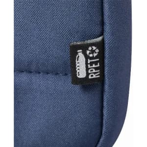 A close-up of a navy blue fabric, featuring a small tag with recycling symbol and text indicating RPET material.