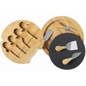 A set of cheese knives with wooden handles, displayed on a bamboo cutting board and a round slate serving platter.