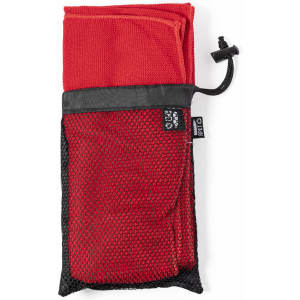 A red towel neatly folded and stored in a black mesh pouch with a drawstring closure.